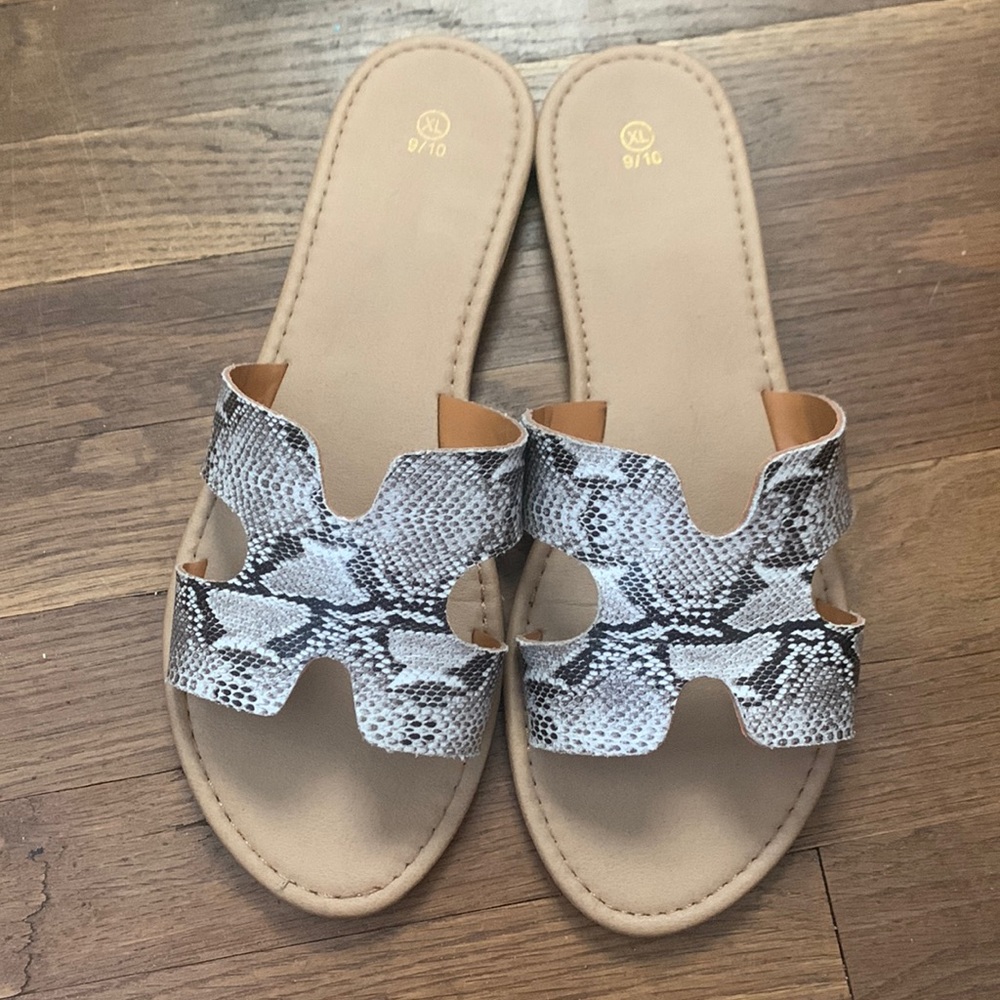 Cute snakeskin print slip on sandal.